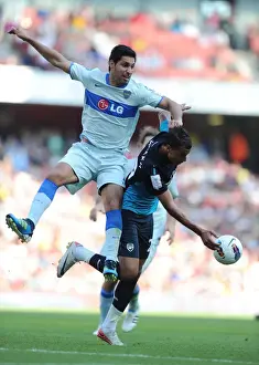 Chamakh vs. Insaurralde: Aerial Battle at the Emirates Cup