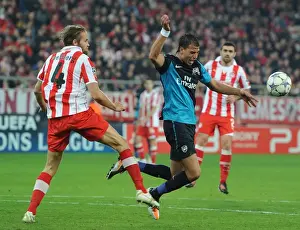 Olympiacos V Arsenal 2011-12 Prints: Chamakh vs. Mellberg: A Battle in the UEFA Champions League between Olympiacos and Arsenal