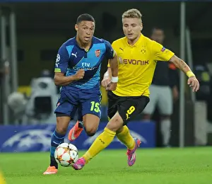 Borussia Dortmund V Arsenal 2014-15 Prints: Chamberlain vs. Immobile: Battle at Signal Iduna Park - Borussia Dortmund vs
