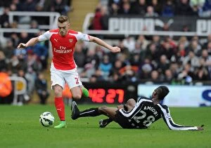 Images Dated 25th February 2009: Chambers Breaks Past Newcastle's Ameobi: Arsenal vs Newcastle, Premier League 2014/15
