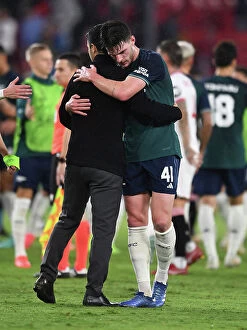 Images Dated 25th October 2023: Champions League 2023-24: Mikel Arteta and Declan Rice Embrace Victory After Sevilla vs