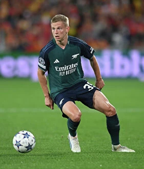 RC Lens v Arsenal 2023-24 Collection: Champions League 2023-24: Oleksandr Zinchenko of Arsenal Faces Off Against RC Lens at Stade