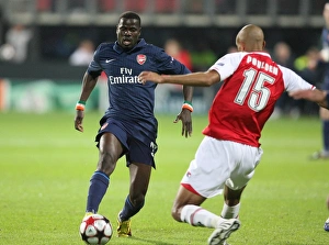 AZ Alkmaar V Arsenal 2009-10 Prints: Champions League Clash: Eboue vs. Poulsen - Arsenal vs. AZ Alkmaar Ends in a 1:1 Draw