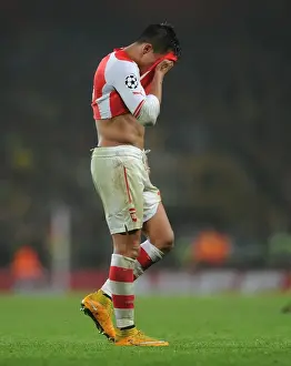 Arsenal V Borussia Dortmund 2014-15 Prints: Champions League Showdown: Arsenal vs Borussia Dortmund - Arsenal's Alexis Sanchez Faces Off