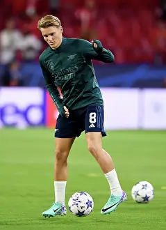 Champions League Showdown: Odegaard's Warm-Up - Sevilla vs. Arsenal (2023-24)
