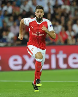 Paris Saint Gernain V Arsenal 2016-17 Prints: Champions League Showdown: Olivier Giroud's Thrilling Battle against Paris Saint-Germain