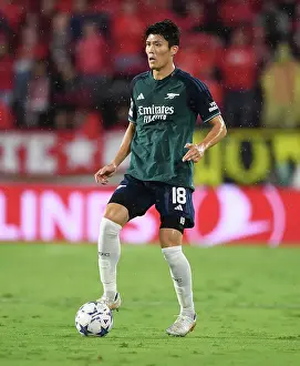 Champions League Showdown: Tomiyasu's Standout Performance - Sevilla vs. Arsenal (2023-24)
