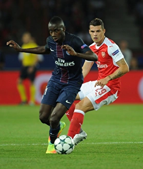 Paris Saint Gernain V Arsenal 2016-17 Prints: Champions League Showdown: Xhaka vs