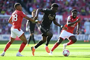 Nottingham Forest V Arsenal 2022-23 Prints: Charging Ahead: Bukayo Saka's Brilliant Performance Leads Arsenal to Victory over Nottingham Forest