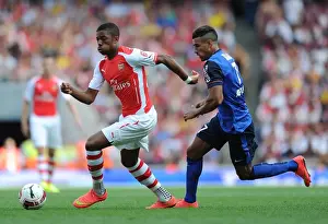Arsenal V AS Monaco 2014-15 Prints: Chuba Akpom Outsmarts Nabil Dirar: Arsenal's Star Forward Shines in Emirates Cup Clash
