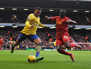 Liverpool V Arsenal 2013-14 Prints: Clash at Anfield: Oxlade-Chamberlain vs. Cissokho in the Premier League Battle