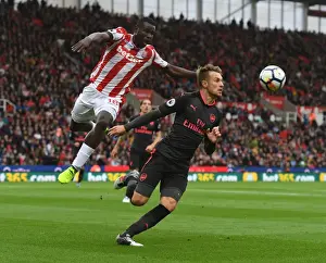 Stoke City V Arsenal 2017-18 Prints: Clash at the Bet365: Ramsey vs. Diouf in Stoke-Arsenal Premier League Showdown