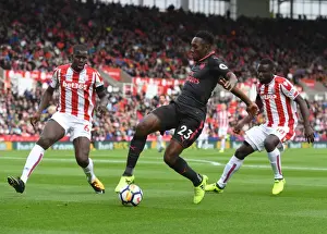 Stoke City V Arsenal 2017-18 Prints: Clash at the Bet365: Welbeck Tangles with Diouf and Kouma of Stoke City in Premier League Showdown