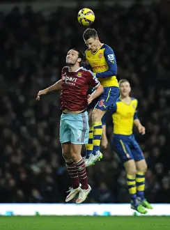 West Ham United V Arsenal 2014-15 Prints: Clash at the Boleyn: Koscielny vs. Carroll in the Premier League Showdown