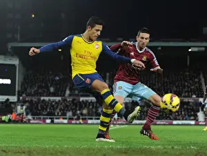 West Ham United V Arsenal 2014-15 Prints: Clash at the Boleyn: Sanchez Faces Off Against Amalfitano in Premier League Showdown