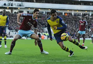 Clash at the Boleyn: Sanchez vs. Tomkins in the Premier League Battle between West Ham and Arsenal