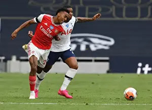Clash in the Capital: Intense Moment between Joe Willock and Steven Bergwijn in the Premier League Battle between Tottenham and Arsenal (2019-20)