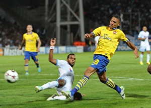 Marseille V Arsenal 2013-14 Prints: Clash of Champions: Kieran Gibbs vs. Giannelli Imbula - Marseille vs. Arsenal (2013-14)