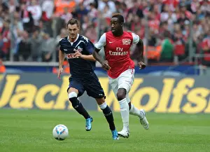 Cologne V Arsenal Prints: Clash of Champions: Novakovic vs. Djourou in Cologne's Battle with Arsenal
