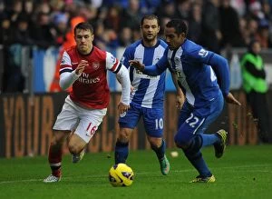 Images Dated 22nd December 2012: Clash of Champions: Ramsey vs. Beausejour - Wigan Athletic vs. Arsenal, Premier League, 2012