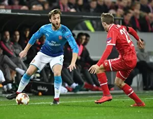 FC Koln v Arsenal 2017-18 Collection: Clash of Defenders: Chambers vs. Horn in Arsenal's Europa League Battle against 1. FC Koln