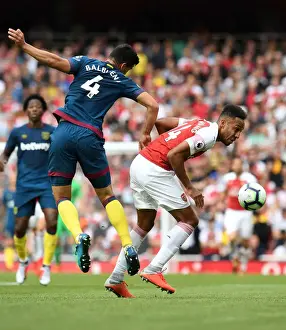 Arsenal V West Ham United 2018-19 Prints: Clash at the Emirates: Aubameyang vs. Fredericks in Arsenal's Battle Against West Ham