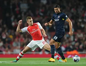 Arsenal V Southampton, League Cup 2014/15 Prints: Clash at the Emirates: Chambers vs. Pelle in the League Cup Battle