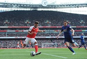 Images Dated 7th May 2017: Clash at Emirates: Matteo Darmian Holds Off Alex Oxlade-Chamberlain