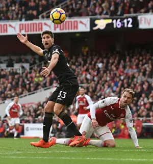 Arsenal V Swansea City 2017-18 Prints: Clash at the Emirates: Ramsey vs. Fernandez in Arsenal's Battle Against Swansea City
