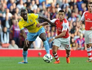 Images Dated 16th August 2014: Clash at Emirates: Sanchez vs. Bolasie in Arsenal vs. Crystal Palace Premier League Showdown