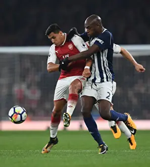 Arsenal V West Bromwich Albion 2017-18 Prints: Clash at Emirates: Sanchez vs. Nyom in Arsenal's Battle Against West Brom