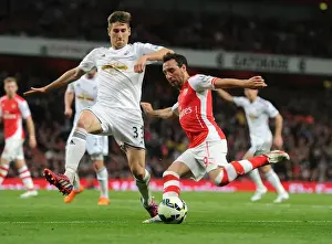Arsenal Swansea City 2014/15 Prints: Clash at Emirates: Santi Cazorla vs Federico Fernandez - A Battle of Midfielders