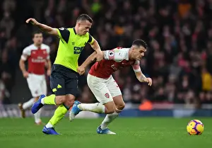 Arsenal V Huddersfield Town - 2018-19 Prints: Clash at Emirates: Xhaka vs Hogg in Arsenal's Battle Against Huddersfield