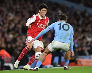 Clash at the Etihad: Tomiyasu vs. Grealish in the FA Cup Showdown (Manchester City vs. Arsenal, 2022-23)