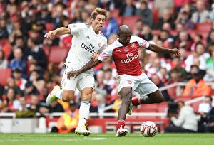Arsenal Legends v Real Madrid Legends 2018-19 Collection: A Clash of Football Greats: Luis Boa Morte Shines for Arsenal Legends vs Real Madrid Legends