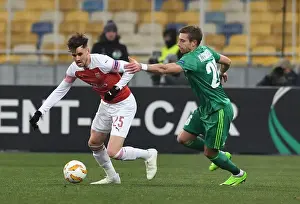 FC Vorskla Poltava V Arsenal 2018-19 Prints: Clash of Forces: Jenkinson vs. Kolomoets in Arsenal's Europa League Battle against Vorskla Poltava