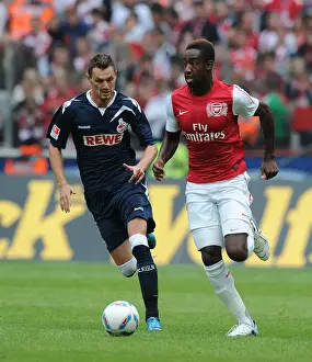 Cologne V Arsenal Prints: Clash of Forces: Novakovic vs. Djourou in Cologne's Battle with Arsenal