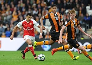 Images Dated 17th September 2016: Clash of Forces: Sanchez vs Davies & Clucas - Hull City vs Arsenal (2016-17)