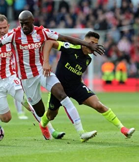 Images Dated 13th May 2017: Clash of Forces: Sanchez vs. Martins Indi - Arsenal vs. Stoke City