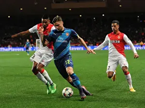 Monaco V Arsenal 2014/15 Prints: Clash of Giants: Olivier Giroud Faces Off Against Wallace and Nabil Dirar in Monaco vs Arsenal UCL Showdown
