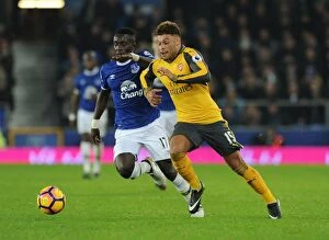 Images Dated 13th December 2016: Clash at Goodison Park: Oxlade-Chamberlain vs. Gueye in Everton vs. Arsenal Premier League Showdown