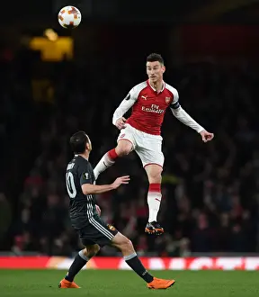 Arsenal V CSKA Moscow 2017-18 Prints: Clash of Heads: Koscielny vs. Dzagoev in Arsenal's Europa League Battle