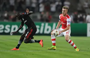 Besiktas V Arsenal 2014-15 Prints: Clash in Istanbul: Calum Chambers Faces Off Against Demba Ba in Arsenal's UEFA Champions League Battle vs Besiktas