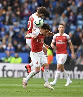 Leicester City v Arsenal 2018-19 Collection: Clash at The King Power: Mustafi and Torreira Battle for the Ball in Leicester City vs Arsenal FC