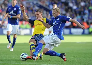 Leicester City V Arsenal 2014-15 Prints: Clash at The King Power: Podolski vs. De Laet in Leicester City vs. Arsenal