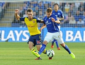Images Dated 31st August 2014: Clash at The King Power: Ramsey vs Albrighton, Leicester vs Arsenal (2014-15)