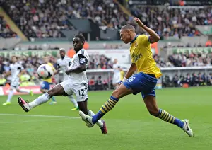 Swansea Prints: Clash at Liberty: Gibbs vs. Dyer in Swansea-Arsenal Premier League Showdown