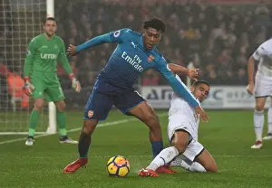 Swansea City V Arsenal 2017-18 Prints: Clash at Liberty: Iwobi vs. Naughton - A Premier League Showdown