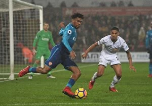 Swansea City v Arsenal 2017-18 Collection: Clash at Liberty: Iwobi vs. Naughton in Swansea Derby