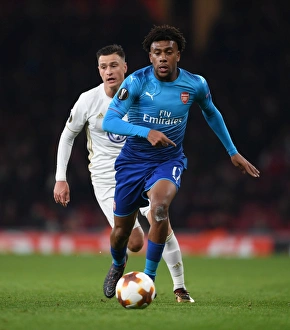 Arsenal V Östersunds FK 2017-18 Prints: Clash of the Midfield: Alex Iwobi vs